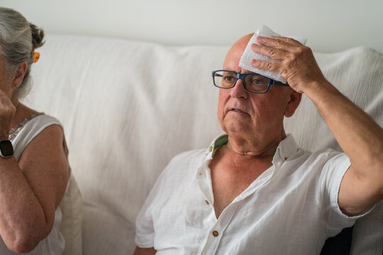Senior man cool down during extreme summer heat