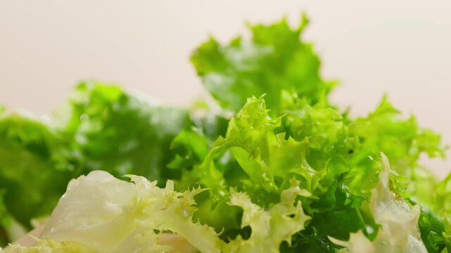 Caesar Dressing or Creamy Sauce Pouring Over Fresh Green Caesar Salad Leaves in Bowl, Close Up of Healthy Food Preparation, Restaurant and Cafe Cooking Concept