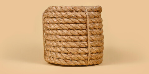 Natural jute rope coil, twisted hemp cord bundle, rustic fiber twine © M Yusril Hadi