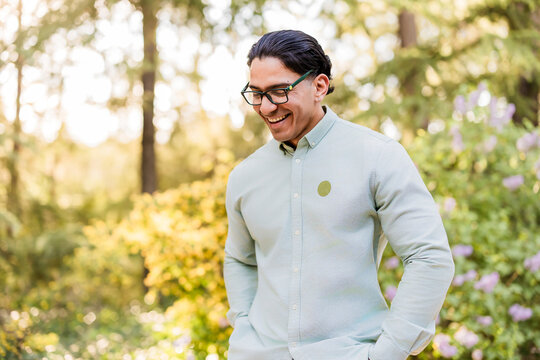 Smiling latino man with disability posing in nature