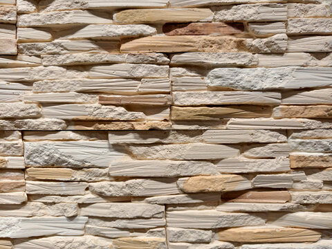Decorative panels replicating brick stone and tile patterns shown in a construction store section for versatile renovation and design enhancement