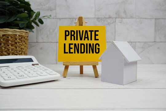 Private Lending text with house model and calculator on wooden background