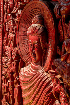 Carved wooden Buddha statue at Wat Si Muang in Vientiane