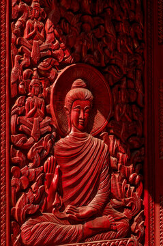 Wooden carved Buddha relief at Wat Si Muang in Vientiane, Laos