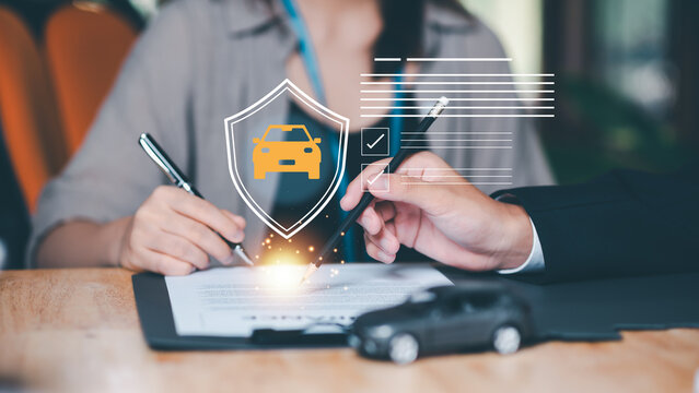 Insurance consultant reviews car insurance, policy agreement, coverage protection, insurance contract, claim process, financial protection, and risk management with clients before policy approval.