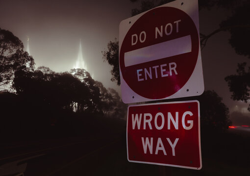 A captivating image of signposts indicating diverging pathways in the fog beautifully represents the theme of direction and choices amidst uncertainty in life&rsquo;s journey.