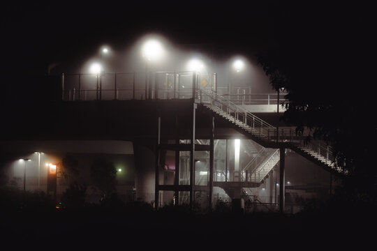 An intriguing shot of a stairway bathed in fog and lights, evoking a sense of wonder and inspiration, inviting viewers to explore the unknown.