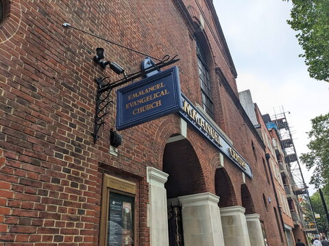 Low angle view of the historic brick facade and sign of the Emmanuel Evangelical Church in London