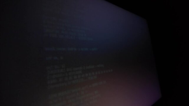 Server system error log lines on a dark computer monitor close up view of logs