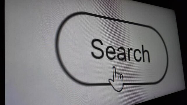 Mouse cursor clicking the search button on a dark computer monitor screen