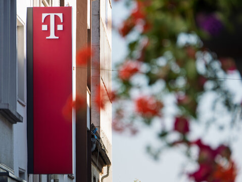 Telekom Store Front with Vibrant Floral Background