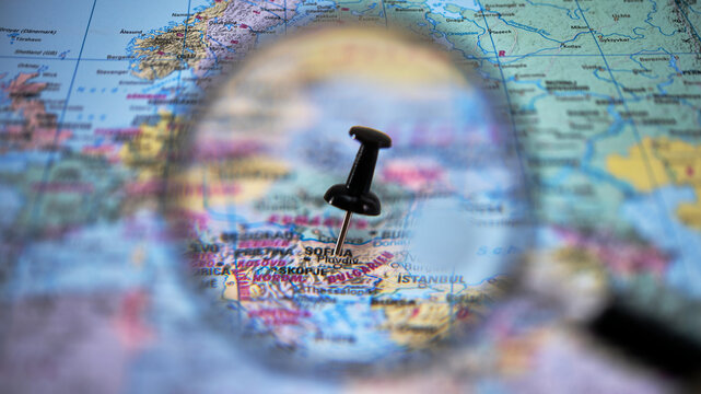 Map with a magnifying glass highlighting a pin in Sofia, Bulgaria