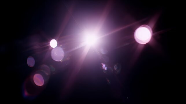 Vibrant purple starburst lens flare on dark background. Magical glowing light leak overlay for creative photo editing and design.