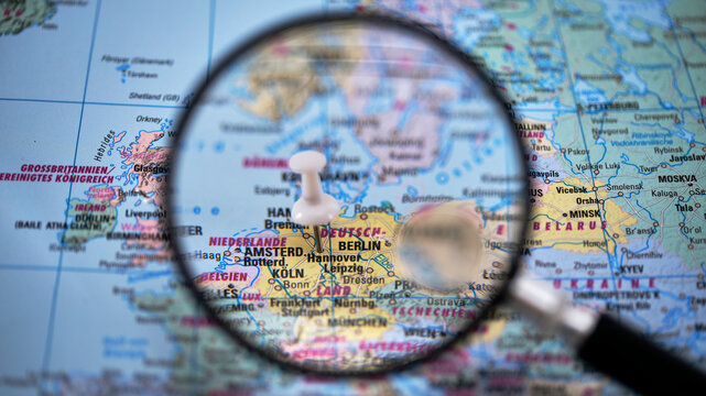 Magnifying glass focused on a map showing Hannover cities