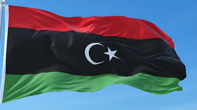 Libyan flag waving in the wind against a clear blue sky, national symbol of freedom and independence, vibrant colors in motion