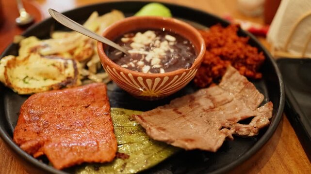 Traditional Oaxacan Food Platter With Mole Beans and Grilled Meat 