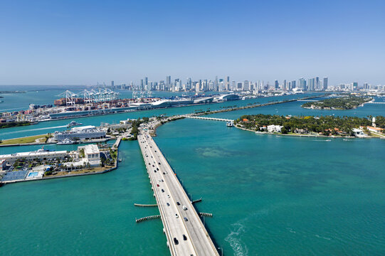 Miami skyline in aerial view. Miami skyline on Biscayne Bay. Miami skyline with bridge and harbor. Miami skyline for urban travel.