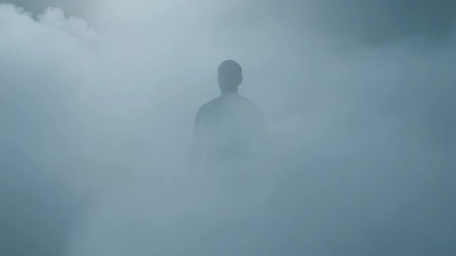 Man as a ghostly translucent silhouette gradually materializes through dense rolling fog. Eerie figure emerging from thick mist. Supernatural and cinematic concept, Horror, Halloween
