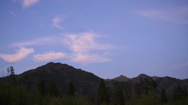 Sunset on Mountain Ridge Above Evergreen Forest Time-Lapse, Bob Marshall Wilderness Montana