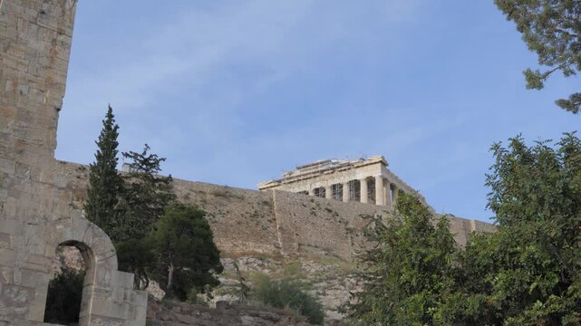 Odeon of Herodes Atticus and Parthenon at the Acropolis of Athens. Panning Shot