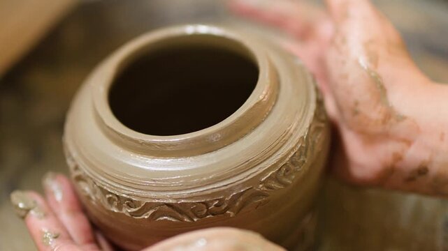 Artisan Potter Shaping Clay Pot on Spinning Wheel in Nonthaburi