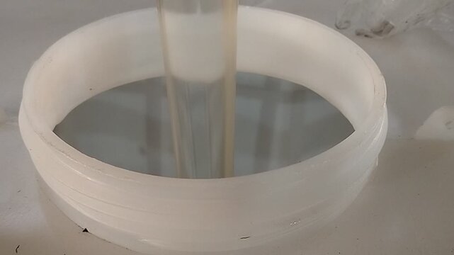 Filling chemical liquid into IBC tote tank during industrial manufacturing process