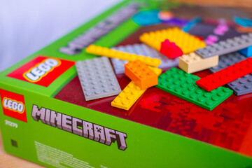 Fototapeta premium LEGO Minecraft box, multicolored plastic bricks, Colorful toy set, building blocks, development fine motor skills, play time, creative activity product detail, brand identity, creating something new