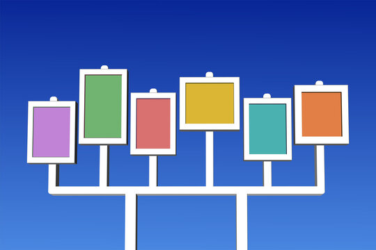Multicolored blank signboards on blue sky background