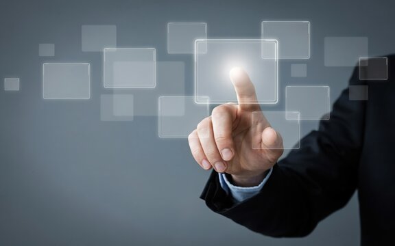 Businessman touching a digital interface screen