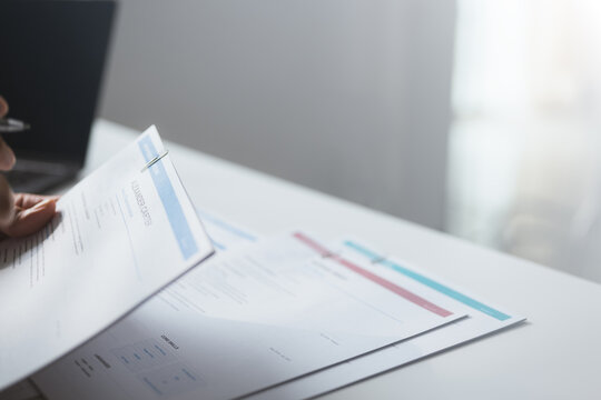 financial report, budget analysis, and document review shape this practical household finance scene. The composition communicates financial awareness, thoughtful choices, and household organization.