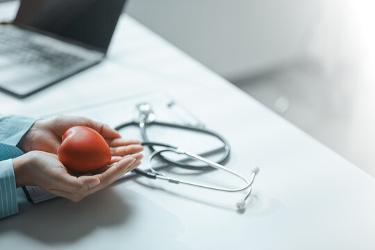 This focused image brings together health insurance, financial protection, and heart symbol. It conveys practical choices, organized planning, everyday money management, and financial awareness.