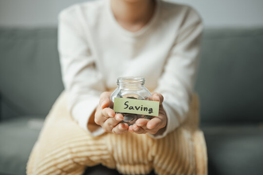 saving money, savings jar, and financial security shape this practical household finance scene. It conveys practical choices, organized planning, everyday money management, and financial awareness.