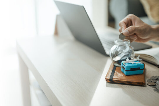 travel savings, coin deposit, and vacation fund shape this practical household finance scene. It conveys practical choices, organized planning, everyday money management, and financial awareness.