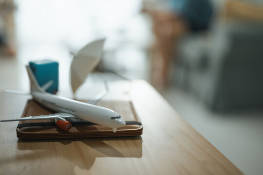 travel planning, airfare budget, and airplane model shape this practical household finance scene. It conveys practical choices, organized planning, everyday money management, and financial awareness.