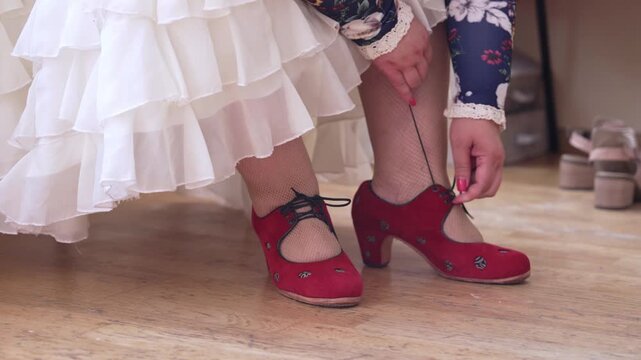 Female Flamenco Dancer Putting On Professional Flamenco Dance Shoes