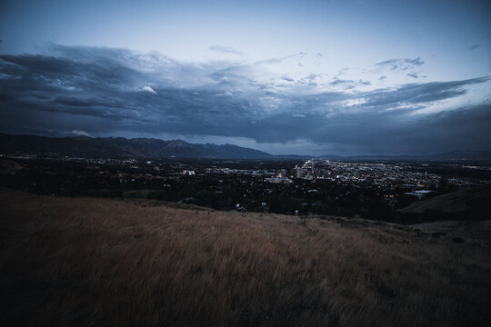 Post Storm Sunset View of Salt Lake City Skyline and Utah State Capitol from Ensign Peak with Wasatch Mountains in Summer