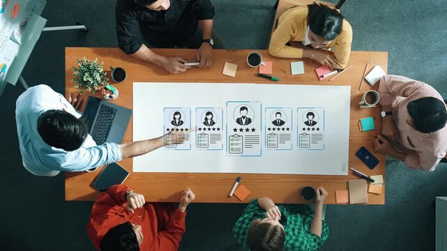 Collaborative Team Meeting with Diverse Professionals Discussing Project Evaluation and Feedback on User Personas in Modern Office Environment. Entropy.