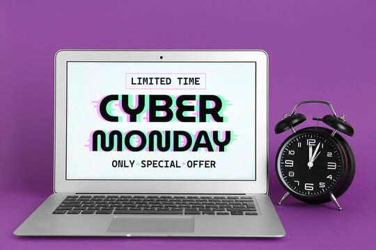 Laptop with alarm clock on purple background. Cyber Monday Sale