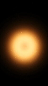 Glowing orange sun orb on black background