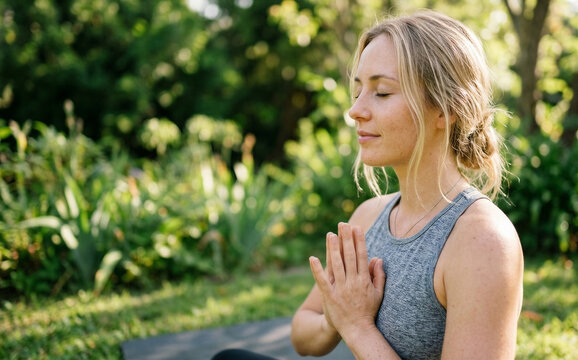 A simple meditation pose creates an elegant impression and balanced daily living.