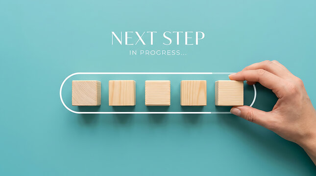 Hand placing the final wooden cube into a progress bar