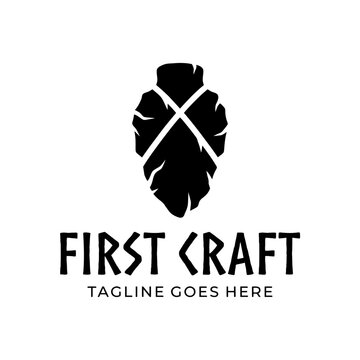 Rugged flint tool icon representing traditional craftsmanship, strength, and outdoor adventure.