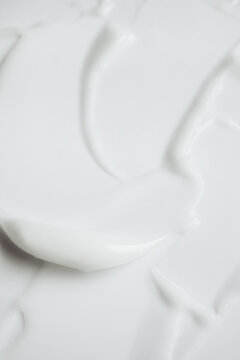 White cosmetic texture with abstract waves and soft peaks