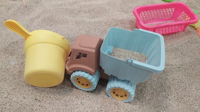 Colorful Plastic Toy Dump Truck and Bucket on Sand,
Kids Beach Toys Plastic Dump Truck and Bucket Playing in Sandpit