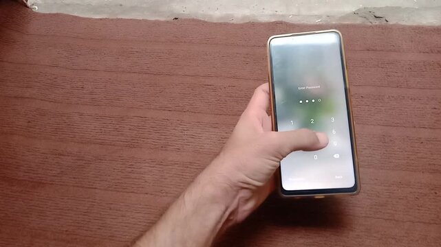 Close up of person holding and using a modern Android smartphone