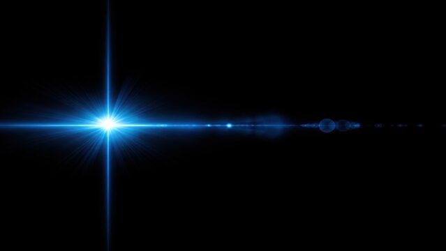 Abstract blue lens flare light effect with glowing rays isolated on a dark black background for graphic design