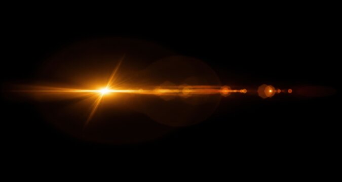 Abstract golden horizontal light effect with lens flare isolated on a black background for creative design projects