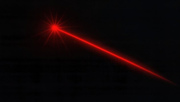 A bright red laser beam cutting through darkness creating a sharp glowing light effect on a black background