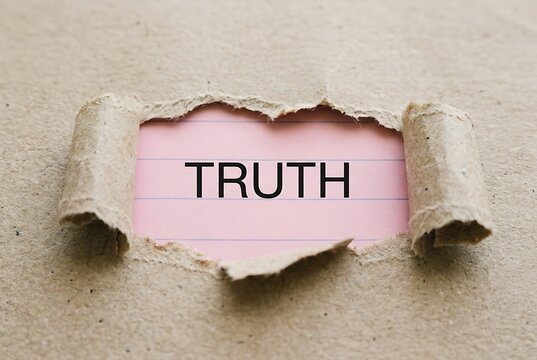 Torn paper reveals the word TRUTH on pink lined background. Transparency and Honesty concept