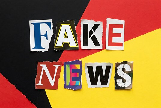Torn letters spell FAKE NEWS on a colorful background, representing misinformation concept.